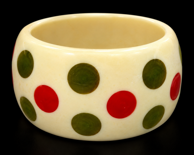 Shultz bakelite dots on cream lucite bangle